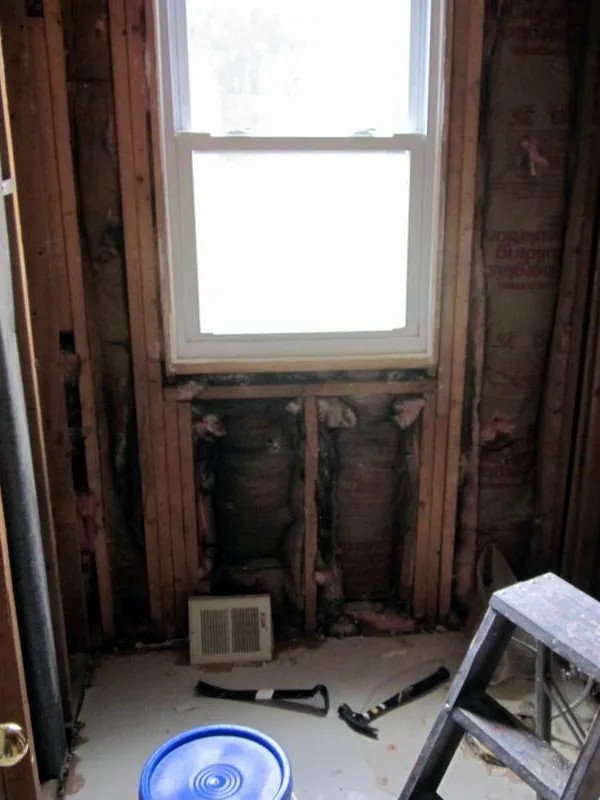 Powder room stripped to the studs during renovation