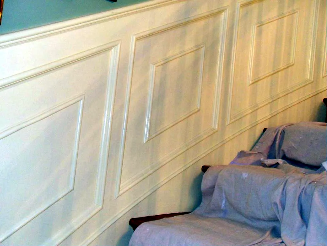 Raised-panel wainscoting following a staircase wall